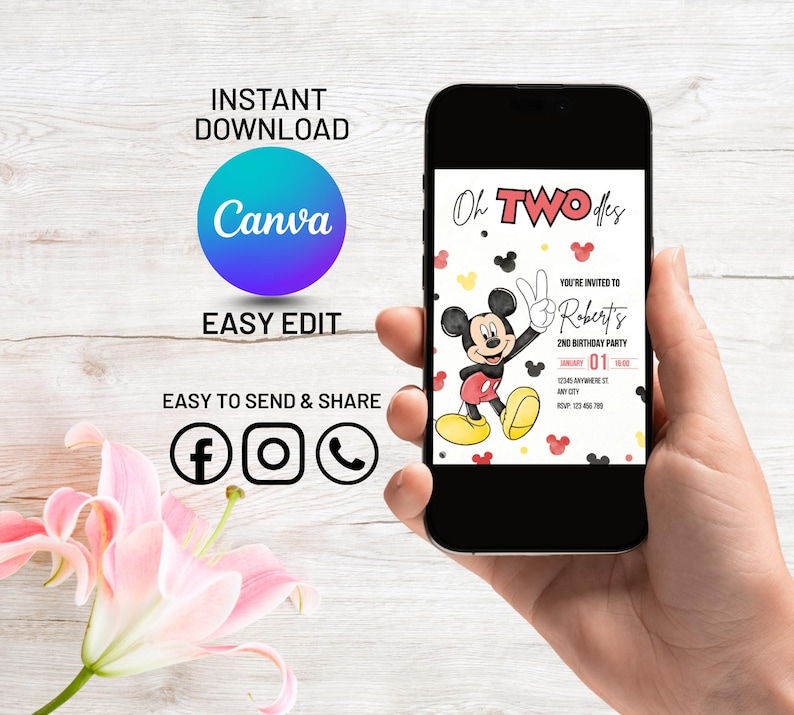 May include: A smartphone displays a birthday party invitation featuring Mickey Mouse. The invitation reads "Oh TWO-dles" and includes the text "You're invited to Robert's 2nd Birthday Party". The phone is held in a hand, with additional text and social media icons visible.