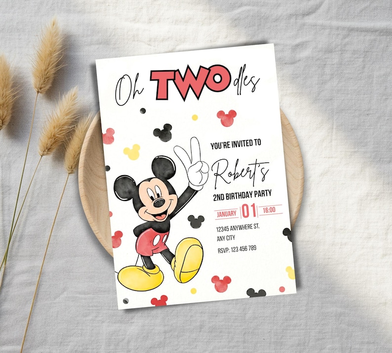 May include: A birthday party invitation featuring Mickey Mouse. The invitation reads "Oh TWO dles" with the text "You're invited to Robert's 2nd Birthday Party". The date is January 1st at 16:00. Mickey Mouse is shown giving a peace sign.