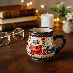 Ceramic mug displayed on a wooden table with soft natural home decor styling.
