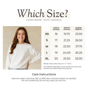 May include: White youth crewneck sweatshirt with size chart. The chart lists measurements for XS to XL sizes, including width, height, and sleeve length in inches. Care instructions are also provided, detailing washing and drying guidelines.