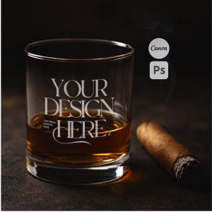 May include: A clear rocks glass with the text "YOUR DESIGN HERE" and a partially smoked cigar. The glass is filled with amber liquid. The background is dark and textured.
