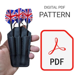 May include: A black leather dart case with three slots holding darts with Union Jack flag flights. The text DIGITAL PDF PATTERN is displayed above a red-bordered white icon containing a red PDF symbol and the black text PDF below it.