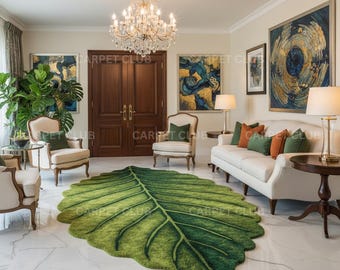 May include: A living room featuring a large, leaf-shaped green rug. The rug is the focal point, surrounded by white furniture, green and orange throw pillows, and artwork. A chandelier hangs from the ceiling, and the walls are a neutral color.