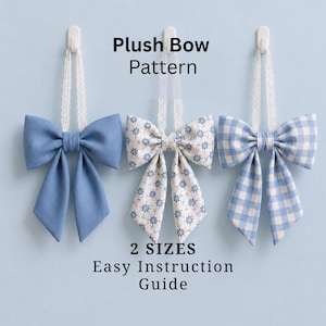 May include: Three plush bows in shades of blue and white hang against a light blue background. The bows are suspended by white lace. Text on the image reads "Plush Bow Pattern", "2 Sizes", and "Easy Instruction Guide".