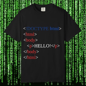 May include: Black t-shirt with HTML code printed on the front. The code includes "<!DOCTYPE html>", "<html>", "<body>", "<p>HELLO!</p>", "</body>", and "</html>" in blue and red text. The background features a green binary code pattern.