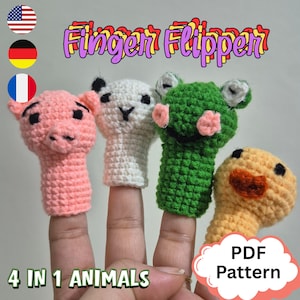 May include: Four crocheted finger puppets: a pink pig, a white panda, a green frog, and a yellow duck. The puppets are labelled "Finger Flipper" and "4 in 1 Animals". A "PDF Pattern" label is also present.
