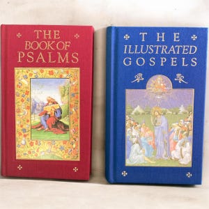 May include: Two hardcover books with gold lettering. The red book is titled THE BOOK OF PSALMS and features a central illustration of a figure playing a harp. The blue book is titled THE ILLUSTRATED GOSPELS and depicts a religious scene.