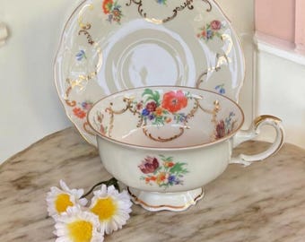 Set da tazza e piattino Edelstein Bavaria Germania con bouquet di fiori primaverili e finiture in oro 24 carati, stile vintage anni '50.