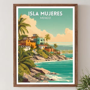 May include: A framed art print featuring a colorful illustration of Isla Mujeres, Mexico. The artwork depicts buildings along a coastline with palm trees, turquoise water, and the text "ISLA MUJERES MEXICO" at the top.