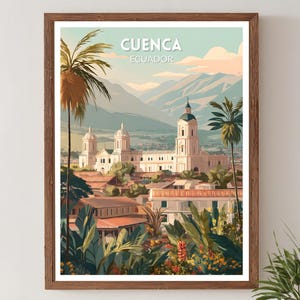 May include: A framed art print featuring a colorful illustration of Cuenca, Ecuador. The artwork depicts a cityscape with white buildings, palm trees, and mountains in the background. The text "CUENCA ECUADOR" is at the top.