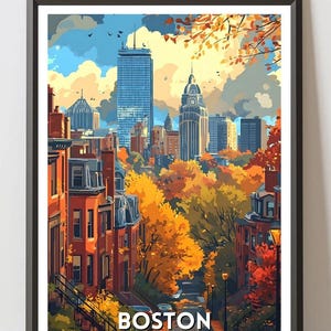 May include: A framed art print of Boston, Massachusetts, featuring a cityscape with tall buildings and autumn foliage. The artwork displays a street scene with brownstone buildings, trees with orange and yellow leaves, and the text "BOSTON UNITED STATES".