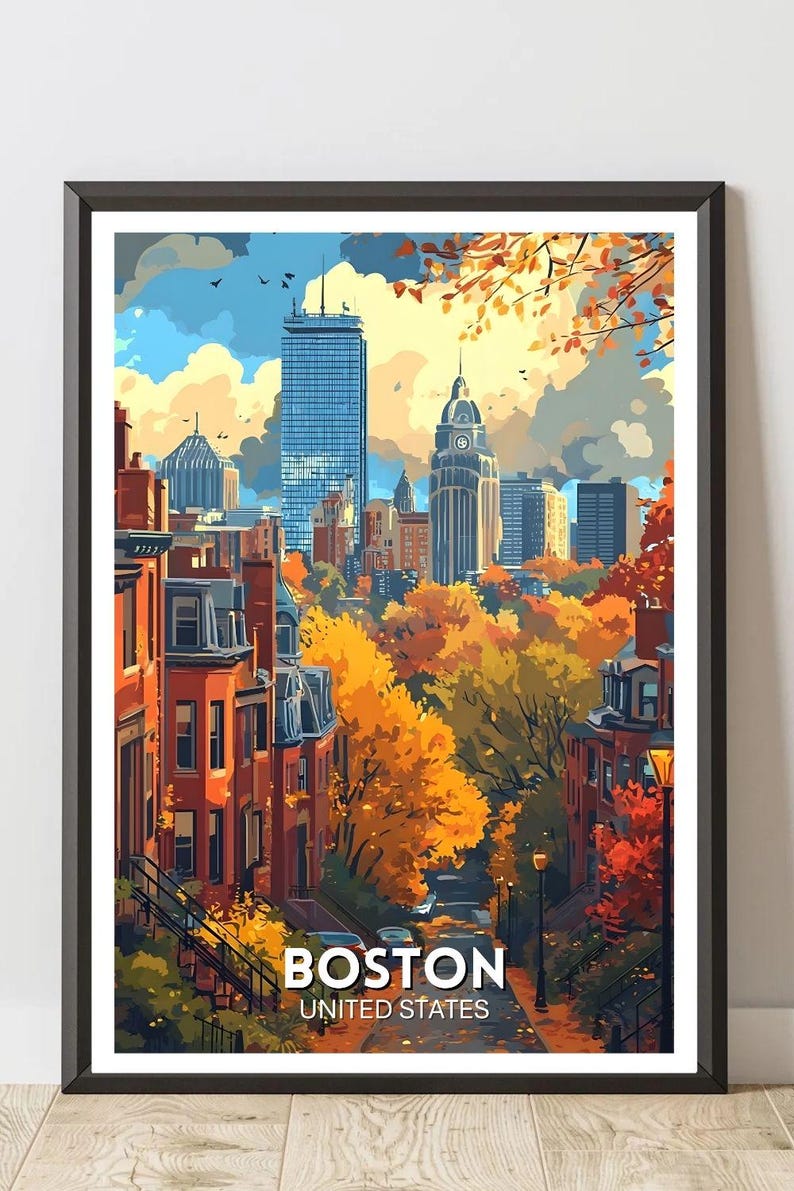 May include: A framed art print of Boston, Massachusetts, featuring a cityscape with tall buildings and autumn foliage. The artwork displays a street scene with brownstone buildings, trees with orange and yellow leaves, and the text "BOSTON UNITED STATES".