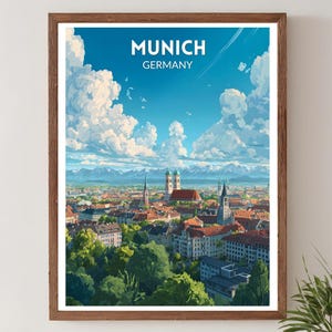 Peut inclure: Une affiche encadrée de Munich, en Allemagne, représentant un paysage urbain sous un ciel bleu clair avec des nuages blancs et duveteux. Le nom de la ville est en haut.