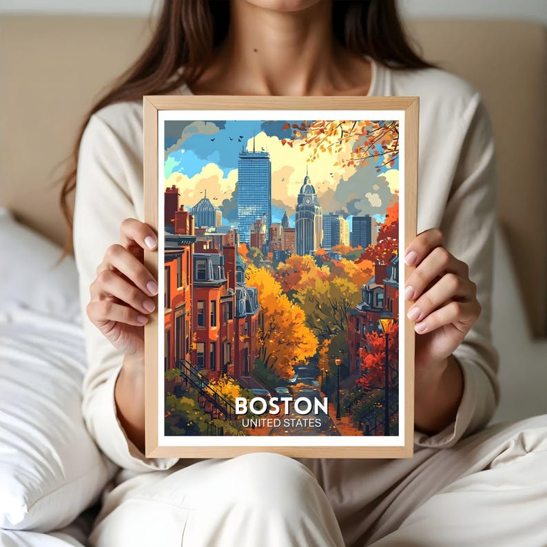 May include: A framed art print featuring a colorful illustration of the Boston skyline. The artwork showcases the city's architecture with vibrant autumn foliage. The print includes the text "BOSTON UNITED STATES" at the bottom.