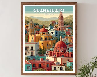 Könnte beinhalten: Gerahmter Kunstdruck mit einer farbenfrohen Illustration von Guanajuato, Mexiko. Das Kunstwerk zeigt ein lebendiges Stadtbild mit Gebäuden in Rot-, Gelb-, Blau- und Orangetönen, mit dem Text "GUANAJUATO MEXICO" oben.
