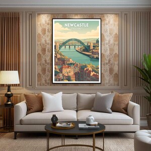 May include: A framed art print featuring a stylized illustration of Newcastle, England. The artwork depicts a green arch bridge over a river, with buildings and the text "Newcastle England" in a vintage style.