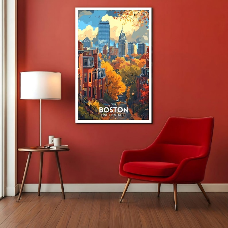May include: A framed art print of Boston, United States, featuring a colorful cityscape with autumn foliage. The artwork showcases buildings, trees, and the text "BOSTON UNITED STATES". The print is displayed on a red wall.