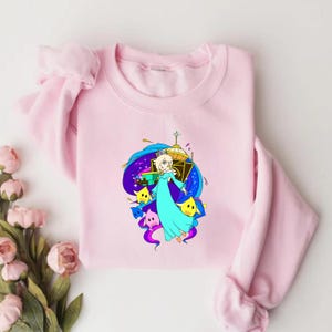 May include: A white ceramic mug with a black handle and the text "But first, coffee" in a handwritten style. The mug is on a white surface. The mug is approximately 4 inches tall.