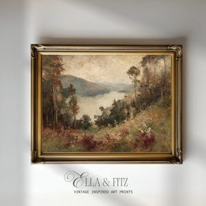 May include: An antique landscape painting in a gold ornate frame. The artwork depicts a serene lake scene with trees and hills. The color palette includes greens, browns, and muted tones. The text "Ella & Fitz Vintage Inspired Art Prints" is at the bottom.