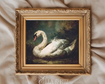 Può includere: Una stampa artistica incorniciata di ispirazione vintage raffigurante un cigno bianco con becco rosso. Il cigno è ambientato su uno sfondo scuro e cupo. La cornice è dorata con dettagli ornati. Il testo "Ella & Fitz" e "Vintage Inspired Art Prints" è in basso.