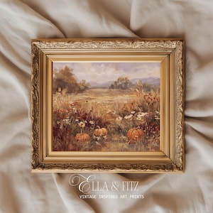 May include: A rectangular landscape painting in an ornate gold frame featuring a field with orange pumpkins, white daisies, and tall grasses under a cloudy sky. The text "ELLA & FITZ VINTAGE INSPIRED ART PRINTS" is printed in white below the frame.