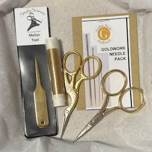 May include: A craft kit with gold-colored tools and supplies. Includes a Mellor tool, gold thread, two pairs of scissors, and a needle pack. The kit is packaged with the "Simply Scissors" and "Golden Hinde Goldwork" labels.