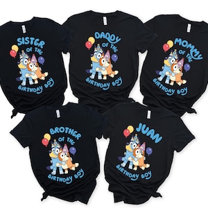 May include: Five black t-shirts featuring a cartoon dog graphic with balloons and party hats. Text on the shirts reads "Sister of the Birthday Boy", "Daddy of the Birthday Boy", "Mommy of the Birthday Boy", "Brother of the Birthday Boy", and "Juan".
