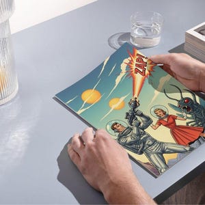 May include: A vintage comic book illustration with a sci-fi theme. The artwork shows astronauts fighting a giant insect with a ray gun. The word "ZAP!" is in a speech bubble. The comic is held by a person.