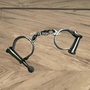 Vintage Handcuffs with Chain – Unique Collectible Prisoner Restraints, Historical Law Enforcement Memorabilia, Display Piece for Collectors