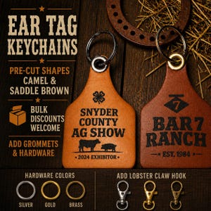 May include: Two leather ear tag keychains in camel and saddle brown colors. The camel tag features a clover icon, text reading SNYDER COUNTY AG SHOW 2024 EXHIBITOR, and cow and pig silhouettes. The brown tag displays a diamond logo with 7, BAR 7 RANCH, and EST. 1984.