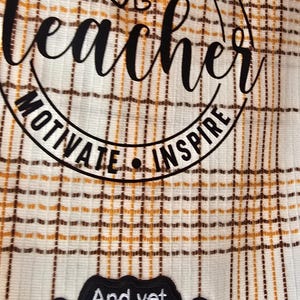 May include: A white and brown plaid fabric with the words "Listen, Encourage, Teacher, Motivate, Inspire" in a circular design. Below, a black patch reads "And yet, despite the look on my face, you're still talking."