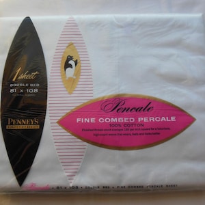 May include: White double bed sheet, 81 x 108 inches, in its original packaging. The packaging features a black oval with text, a pink and gold label with the word "Pencale", and a penguin logo. Made of 100% cotton.
