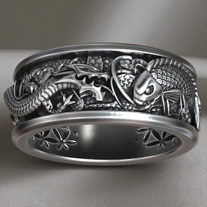 Dragon versus koi fish battle ring, forged in samurai tradition with dynamic Japanese mythology storytelling carved into every detail.