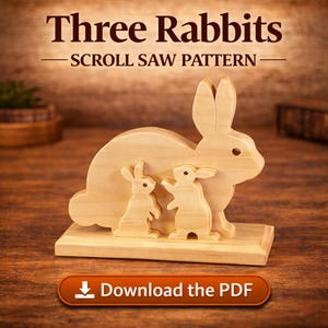 May include: A wooden scroll saw pattern for a family of three rabbits. The text "Three Rabbits - Scroll Saw Pattern" is at the top. The image includes a button that says "Download the PDF".