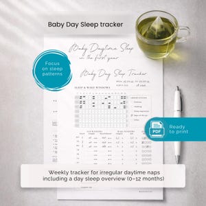 May include: A white printable baby day sleep tracker with the text "Baby Day Sleep Tracker" and "Baby Daytime Sleep in the first year". Includes a sleep and wake windows chart, a pen, and a cup of tea. The text "Ready to print" is also visible.