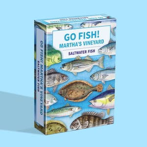 May include: A colorful box of "Go Fish! Martha's Vineyard Saltwater Fish" playing cards. The box features illustrations of various fish species, with text in blue and white on a light blue background.