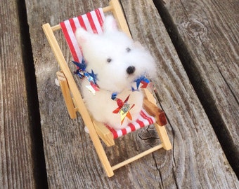 Westie figurine in a miniature beach chair