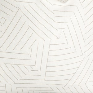 May include: White fabric with a geometric pattern of thin, beige lines forming a series of overlapping squares and rectangles.