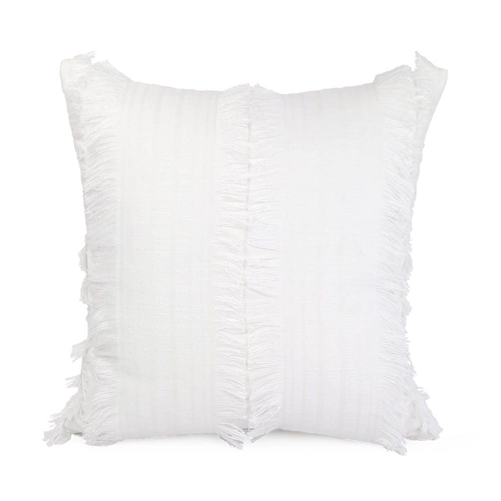 white fringe cushion