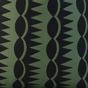 May include: Black and green fabric with a repeating pattern of jagged edges and wavy lines.