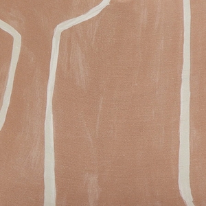 May include: A brown fabric cushion with white abstract lines. The cushion has a textured surface.