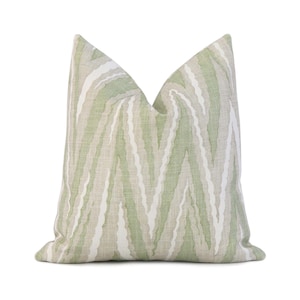 May include: A green and white striped throw pillow with a subtle zebra pattern.