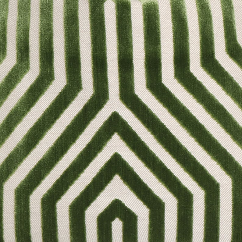 May include: Green and white striped fabric with a geometric pattern. The fabric has a textured, velvety feel.