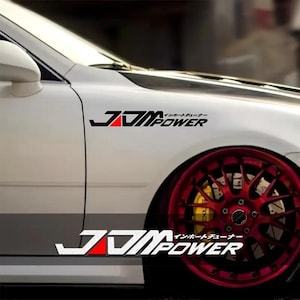 May include: A set of three ceramic mugs with a speckled, matte finish. The mugs are in shades of cream, light grey, and dark grey. Each mug has a simple, minimalist design, ideal for coffee or tea.