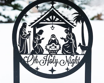May include: Black metal Christmas yard art depicting the nativity scene, with the text "Oh Holy Night". The design includes figures of Mary, Joseph, and baby Jesus, with a star-filled sky and a small dog.
