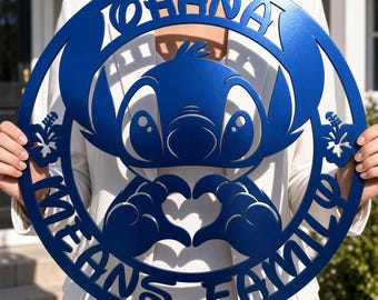 May include: A circular blue metal wall sign featuring a cutout design of the character Stitch making a heart shape with hands. The text OHANA MEANS FAMILY is integrated into the border, flanked by two hibiscus flower cutouts on each side.
