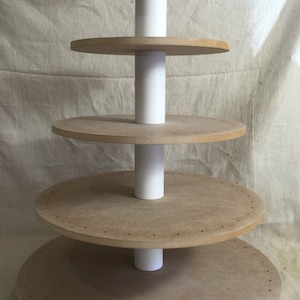 5 tier round unfinished cake pop stand with X base.  Holds up to 134 cake pops.