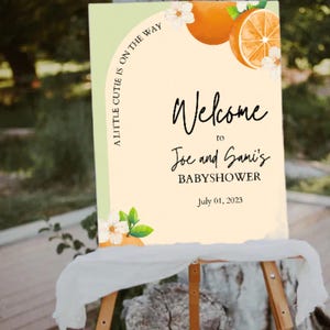 A cutie is on the way baby shower welcome sign