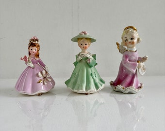 Porcelain Figurines, Josef Originals Girl in Pink, Inarco Girl in Green & Angel Playing Pickle Ball