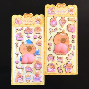 May include: Two sticker sheets with cartoon bear designs. The stickers feature bears with desserts, wearing hats, and holding items. The sheets are yellow with the text "PP sticker" at the top. The stickers are in various colors, including pink, blue, and brown.